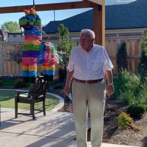 Resident with piñata at Cinco de mayo event