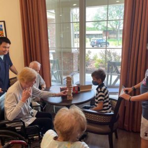 Resident playing games with grandchildren