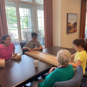 Resident playing games with family
