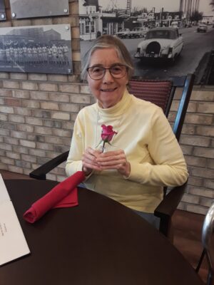 Senior woman holding flower