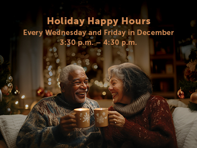 An elderly couple sits together, smiling warmly and holding mugs in a cozy setting.